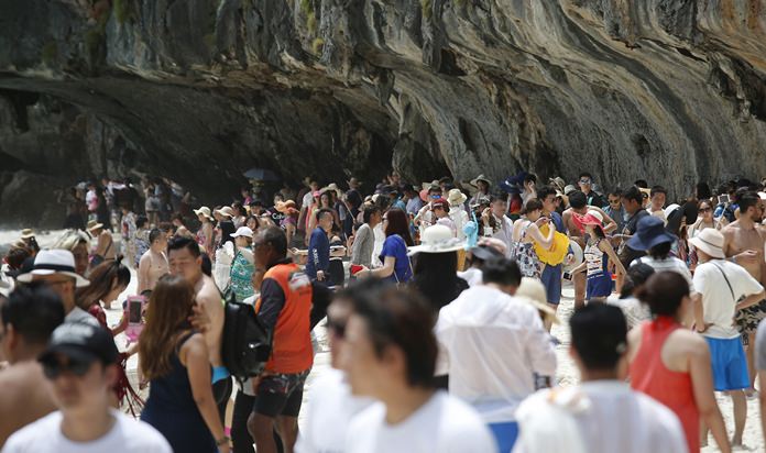 Numerous tourists walk along Maya Bay on Koh Phi Phi Leh in Krabi. The popular tourist destination in the Andaman Sea has closed to tourists for four months.
