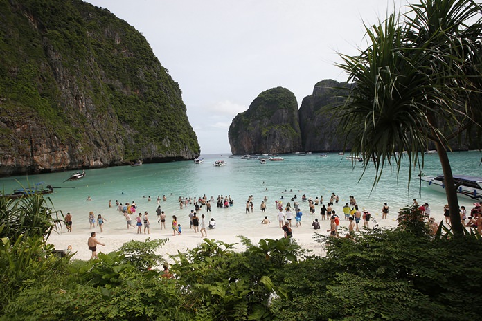 Tourists crowd the beach at Maya Bay.