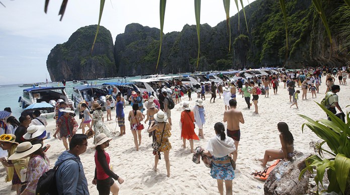 Tourists enjoy Maya Bay Beach on Phi Phi Leh. The government has set a limit of 2,000 tourists a day when the bay reopens.