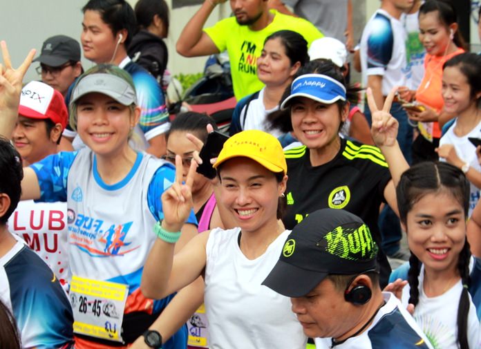 Runners are all smiles as they cross the start line.