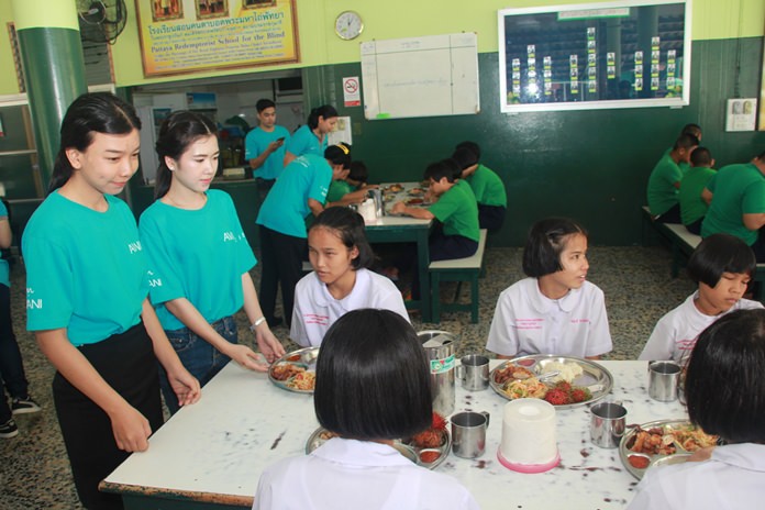 Avani staffers serve lunch to the students of the Redemptorist School for the Blind.