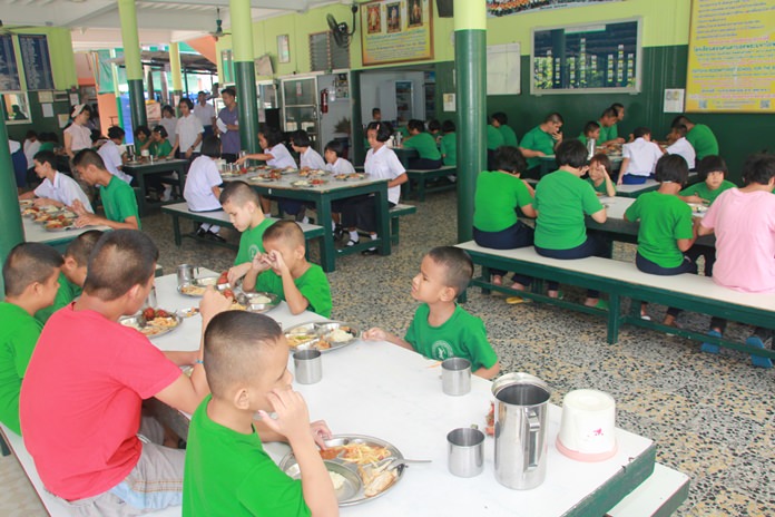 Students of the Redemptorist School for the Blind enjoy lunch served by food and hospitality staff from Avani.