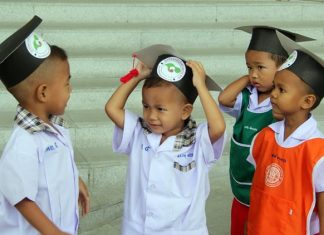 Comparing graduating caps.