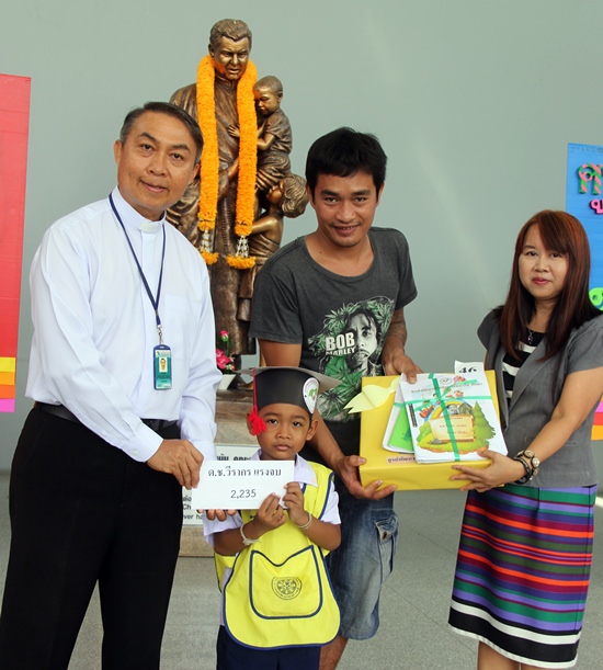 Father Peter presented certificates, a gift and cash to the graduates.