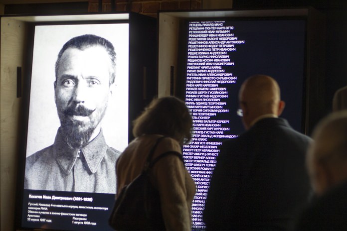 Visitors look at an exposition at the Gulag history museum in Moscow, Russia. (AP Photo/Alexander Zemlianichenko)