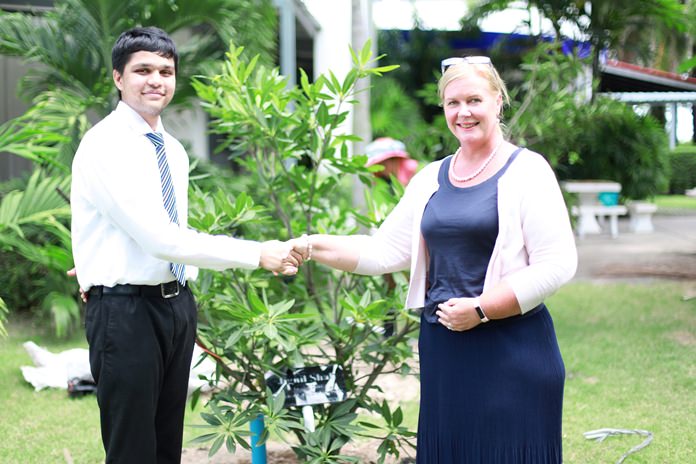 GIS Principal Mrs Hawtree congratulates Jignil.