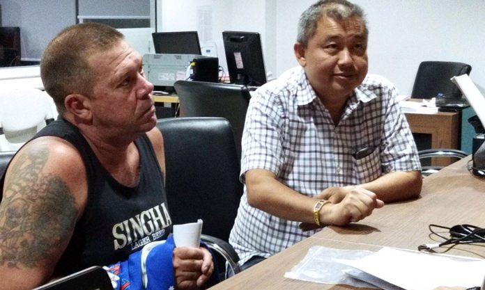 In this Monday, June 18, 2018, photo, Australian Stephen Allan Carpenter, left, is detained by police in Pattaya. (AP Photo)