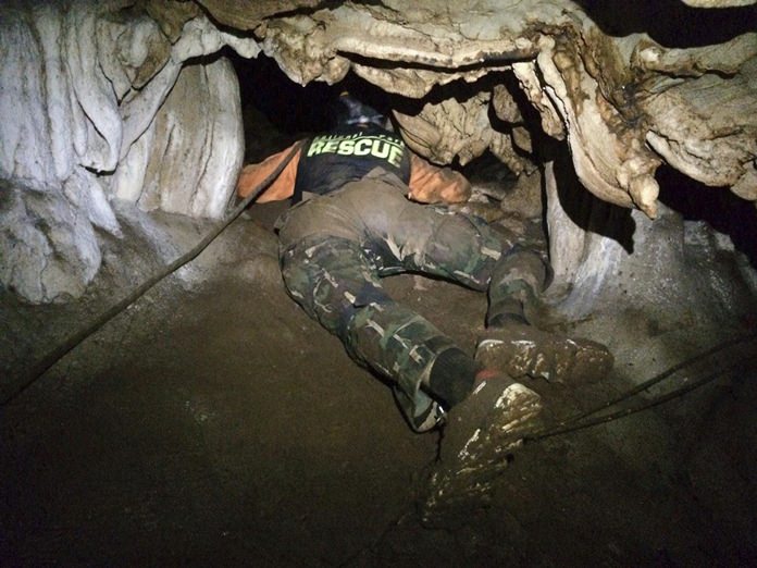 In this photo released by the Thailand Department of National Parks and Wildlife, Wednesday, June 27, 2018, rescue personnel search for alternate entrances to a cave where 12 boys of a soccer team and their coach went missing in Mae Sai, Chiang Rai, northern Thailand. (Thailand Department of National Parks and Wildlife via AP)