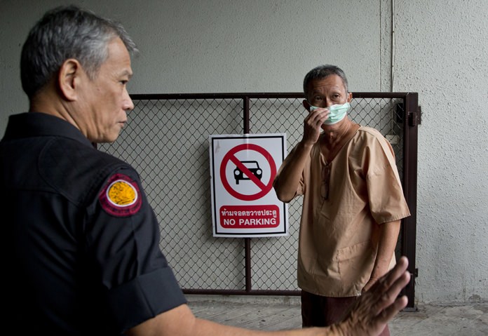Human rights lawyer Prawet Prapanukul arrives for his appearance in a criminal court in Bangkok, Wednesday, June 27. (AP Photo/Gemunu Amarasinghe)
