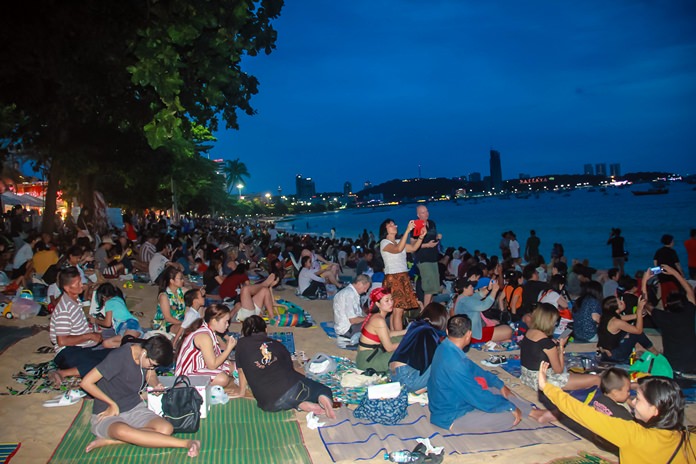 Pattaya Beach was jammed with couples, families and fireworks fans, many of whom brought along mats to stake out a place to sit and watch.