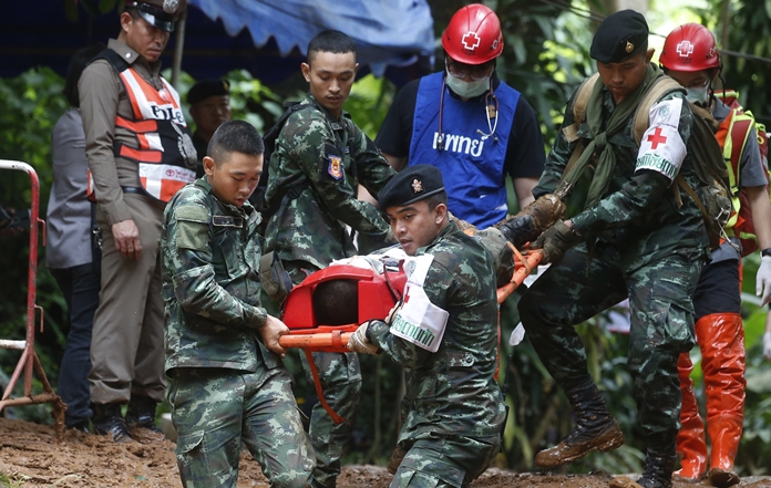 Thai soldiers hold an evacuation drill near the Tham Luang Nang Non cave in Mae Sai, Chiang Rai province, in northern Thailand Saturday, June 30, 2018. Rescuers have been searching for 12 boys and their soccer coach missing for seven days in the flooded cave complex. (AP Photo/Sakchai Lalit)