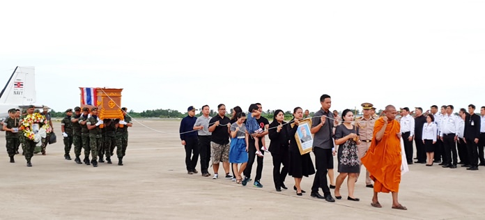 Top navy officers, family and local administrators join the procession to bring Saman Gunan’s remains to Sattahip Temple for a royally sponsored funeral. The former Navy SEAL diver died trying to rescue a boys football team and their coach from a cave near Chiang Rai.