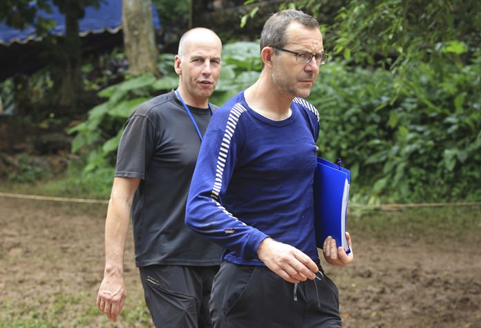 Richard Stanton, left, and John Volanthen arrive in Mae Sai Tuesday, July 3. The two British divers first found the 12 boys and soccer coach on Monday, July 2. They recorded video of the boys talking with them. (AP Photo)
