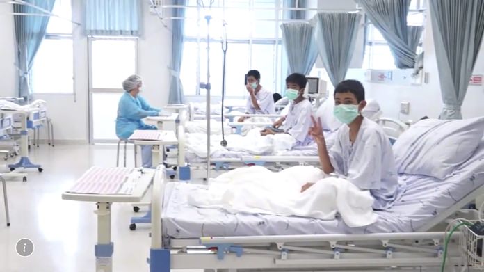 In this image made from video, released by the Thailand Government Spokesman Bureau, three of the 12 boys are seen recovering in their hospital beds after being rescued along with their coach from a flooded cave in Mae Sai, Northern Thailand. (Thailand Government Spokesman Bureau via AP)
