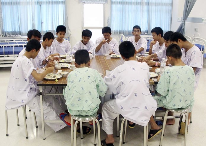 The rescued soccer team members eat a meal together at a hospital in Chiang Rai, northern Thailand. (Thailand’s Ministry of Health and the Chiang Rai Prachanukroh Hospital, via AP, File)