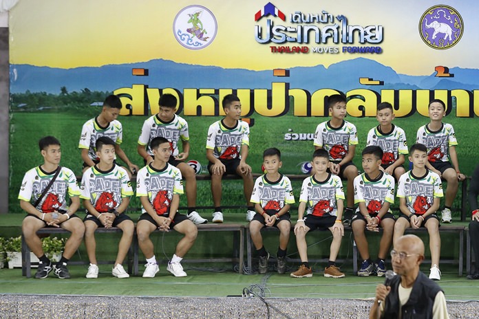Members of the rescued soccer team and their coach sit during a press conference discussing their ordeal. (AP Photo/Vincent Thian)