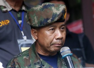 Thai SEALs commander Arpakorn Yookongkaew talks to reporters during a press conference in Mae Sai, Chiang Rai province, in northern Thailand Friday, July 6, 2018. A Thai navy diver working as part of the effort to rescue 12 boys and their soccer coach trapped in a flooded cave died Friday from lack of oxygen, underscoring risks of extracting the team. (AP Photo/Sakchai Lalit)
