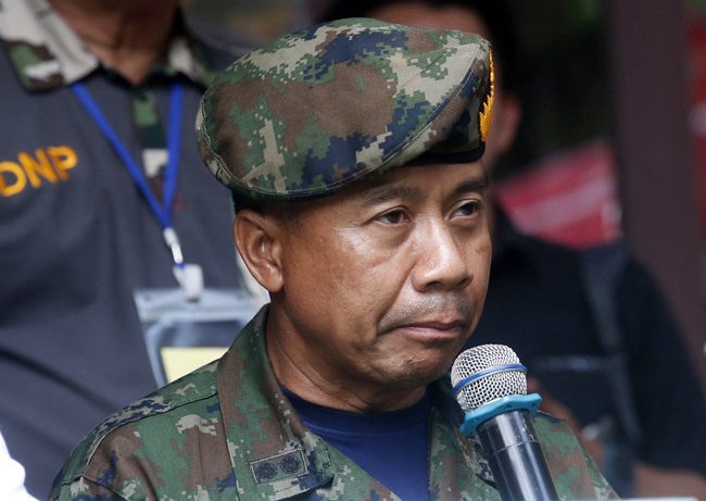 Thai SEALs commander Arpakorn Yookongkaew talks to reporters during a press conference in Mae Sai, Chiang Rai province, in northern Thailand Friday, July 6, 2018. A Thai navy diver working as part of the effort to rescue 12 boys and their soccer coach trapped in a flooded cave died Friday from lack of oxygen, underscoring risks of extracting the team. (AP Photo/Sakchai Lalit)