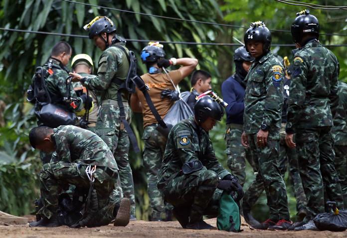 Thai rescuers prepare to enter the cave where 12 boys and their soccer coach have been trapped since June 23, in Mae Sai, Chiang Rai province, in northern Thailand Friday, July 6, 2018. (AP Photo/Sakchai Lalit)