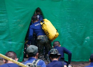 2. Rescuer arrive near cave where 12 boys and their soccer coach have been trapped since June 23, in Mae Sai, Chiang Rai province, in northern Thailand Sunday, July 8, 2018. (AP Photo/Sakchai Lalit)