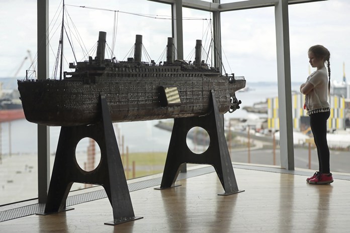 Aoise Taggert, aged nine, looks at a model of the Titanic at Titanic Belfast, Northern Ireland, Tuesday July 24. (Niall Carson/PA Wire(/PA via AP)