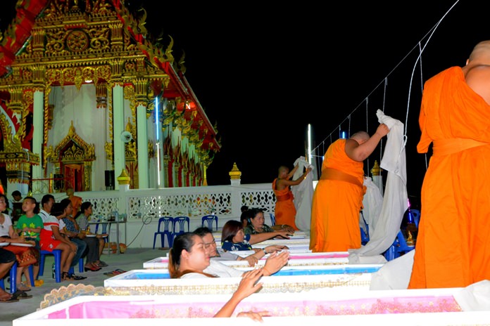 People take part in the living funeral shroud chant ceremony according to the belief they could be reborn.