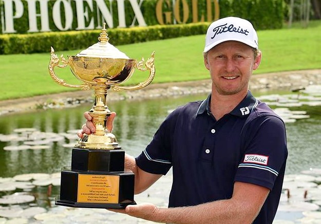 South Africa’s Justin Harding poses with the Royal Cup trophy at Phoenix Gold Golf and Country Club in Pattaya, Sunday, July 29.