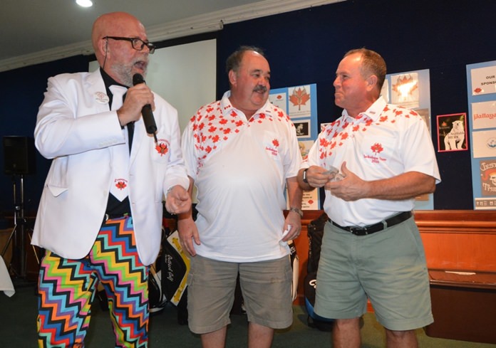 (L to R) Mark Gorda and Jack Levy reward the longest first putt prize, donated by Jack’s Macallan Insurance, to winner Bill Collis who kindly donated 5,000 baht directly to the donation box.