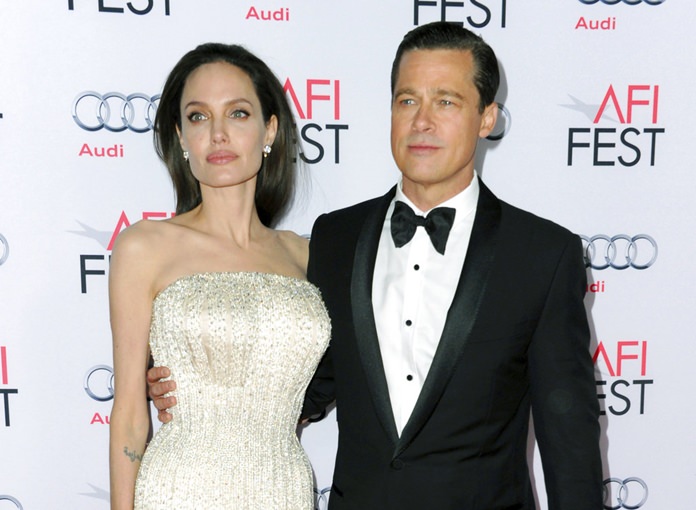 Angelina Jolie (left) and Brad Pitt are shown together in this Nov. 5, 2015 file photo. (Photo by Richard Shotwell/Invision/AP)