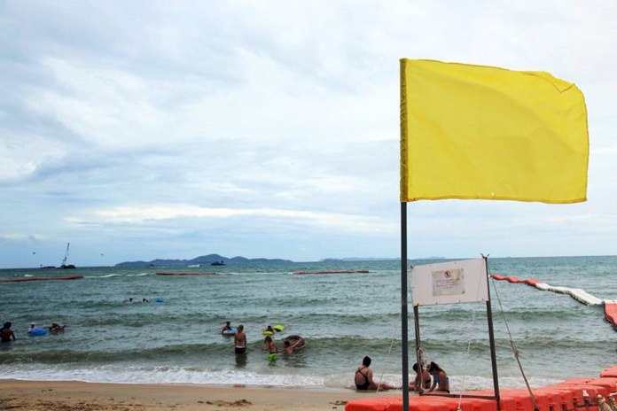 Yellow flags went up on Pattaya-area beaches to warn swimmers to take care when tropical storm Bebinca impacted the area.