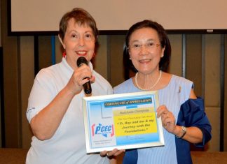 MC Judith Edmonds presents the PCEC’s Certificate of Appreciation to Toy for her heartwarming talk.