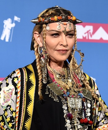 Madonna poses in the press room at the MTV Video Music Awards at Radio City Music Hall on Monday, Aug. 20, in New York. (Photo by Evan Agostini/Invision/AP)