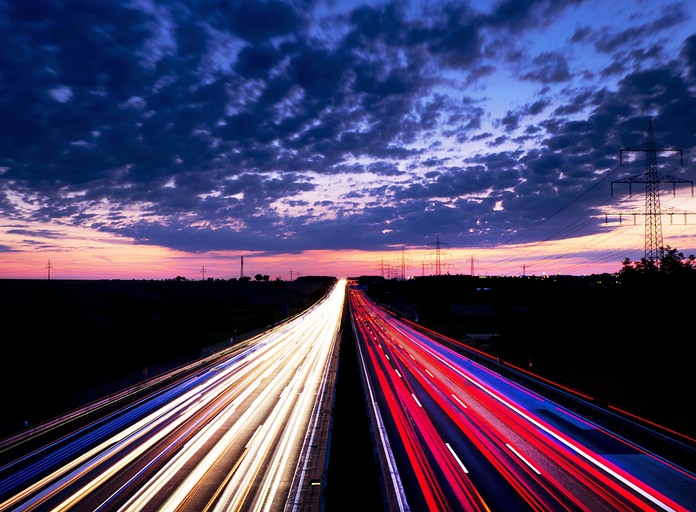 A long exposure picture shows driving cars on the highway just before sunrise near Frankfurt, central Germany on Friday, Aug. 17. (AP Photo/Michael Probst)