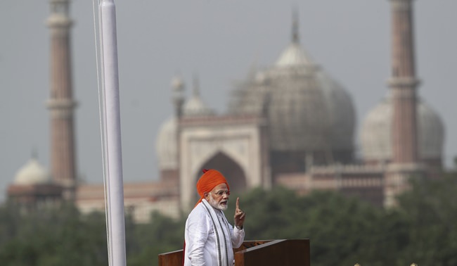 Indian Prime Minister Narendra Modi addresses the nation on the country’s Independence Day from the ramparts of the historical Red Fort in New Delhi, India, Wednesday, Aug. 15, 2018. India will send a manned flight into space by 2022, Modi announced as part of India’s Independence Day celebrations. (AP Photo/Manish Swarup)