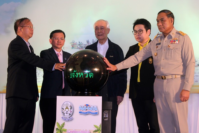 Former Prime Minister Anand Panyarachun, flanked by Department Deputy Commissioner Somchai Sumanatkajonkul and Rattanachai Sutidechanai, the ex-Pattaya councilman who now advises the Tourism and Sports Ministry, announce the rebuilding of Pattaya Beach will be completed by year-end.