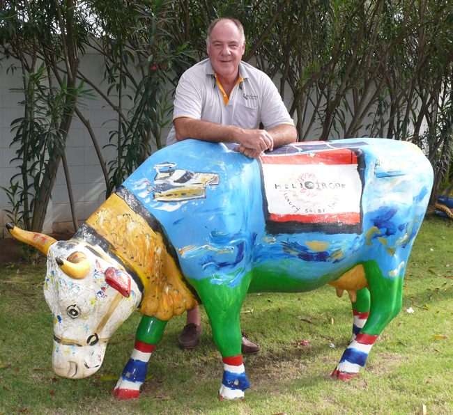 A true Swiss, Philippe stands proudly with one of his three saintly-painted cows grazing in the garden of Bakri Cono Shipyard.
