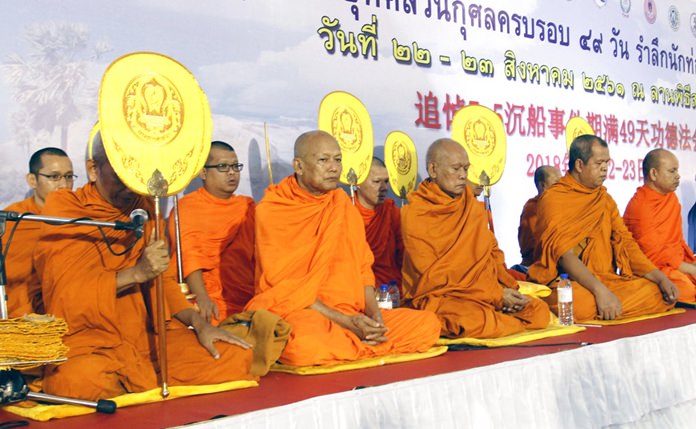 Thai Buddhist monks pray for Chinese boat accident victims in Phuket province, Wednesday, Aug. 22. (AP Photo/Tiwa Suvarnadhanu)