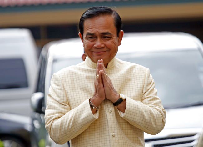 Thai Prime Minister Prayuth Chan-ocha, arrives at the government house for a cabinet meeting in Bangkok, Thailand, Tuesday, Sept. 11, 2018. Thailand's military junta announced it will ease some restrictions on political parties to let them conduct basic functions and prepare for elections set for early next year, but campaigning will still be forbidden. (AP Photo/Sakchai Lalit)