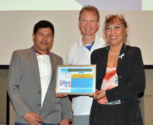 Member Ren Lexander presents the PCEC’s Certificate of Appreciation to Rose Shayachon, while Pisit Chutiphonphongchai, Thai Barrister at Law, looks on.