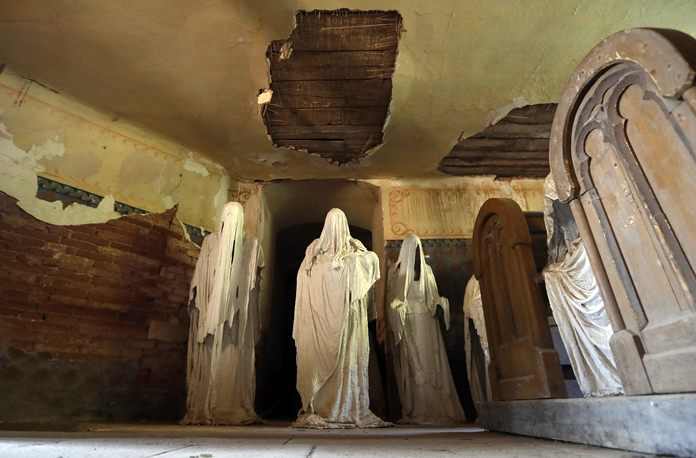 Ghostly figures are displayed at the church of Saint George. (AP Photo/Petr David Josek)