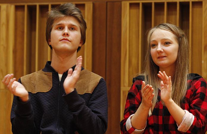 Aleksandra Swigut (right) applauds Tomasz Ritter (left) of Poland who is declared the winner of the 1st Chopin Competition on Period Instruments in Warsaw, Poland, Thursday, Sept. 13. (AP Photo/Czarek Sokolowski)
