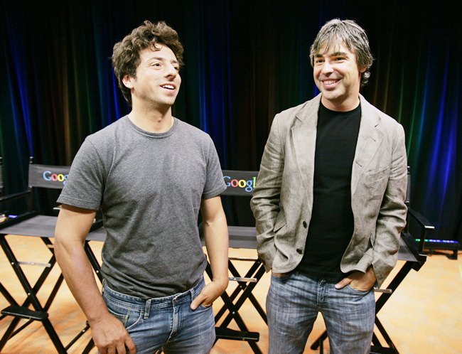 In this Sept. 2, 2008 file photo, Google co-founders Sergey Brin, left, and Larry Page talk during a news conference at Google Inc. headquarters in Mountain View, Calif. (AP Photo/Paul Sakuma, File)