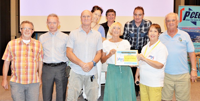 MC Judith Edmonds presents the PCEC’s Certificate of Appreciation to Pattaya Players. From left to right - front row is Bob Smith, PCEC Board member and a Pattaya Player, Authur McNeil, Chris Harman, Wendy Khan, Judith Edmonds, and Doug Campbell – rear row is Mara Swankey, Pauline Elphick and Andrew Murphy.