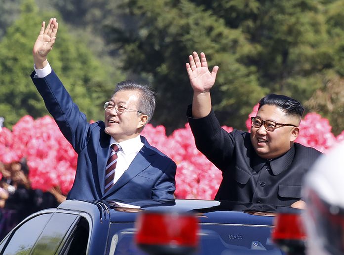 In this Tuesday, Sept. 18, 2018, file photo, South Korean President Moon Jae-in, left, and North Korean leader Kim Jong Un wave from a car during a parade through a street in Pyongyang, North Korea. (Pyongyang Press Corps Pool via AP, File)