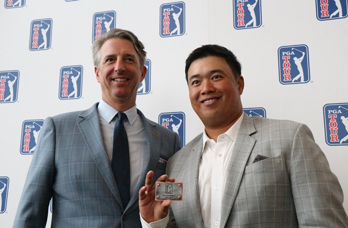 Thai golfer Kiradech Aphibarnrat (right) receives his PGA Tour card from Todd Rhinehart, Vice President and Executive Director of the PGA Tour.
