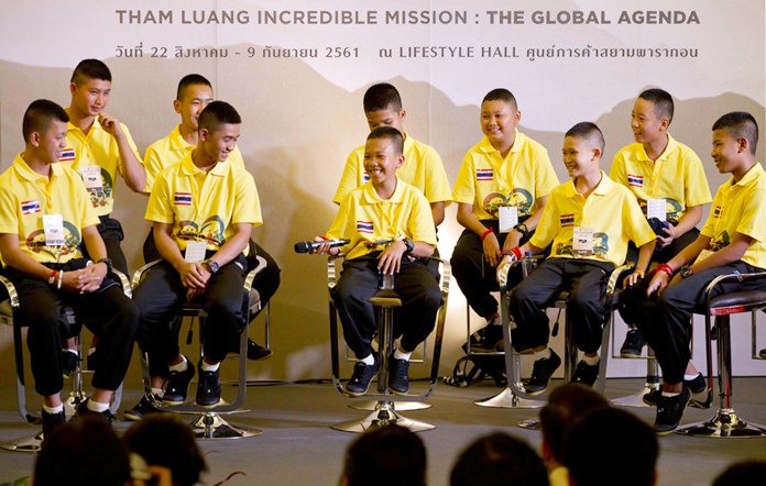 In this Thursday, Sept. 6, 2018, file photo, members of the Wild Boars soccer team laugh during a media conference. (AP Photo/Gemunu Amarasinghe)