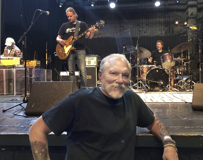 In this Thursday, Sept. 6, 2018 photo, Jorma Kaukonen poses for a photo as his Hot Tuna bandmates do a sound check before a gig at the El Rey Theatre in Los Angeles. (AP Photo/John Rogers)