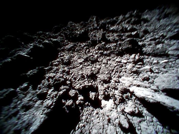 This Sept. 23, 2018 image captured by Rover-1B, and provided by the Japan Aerospace Exploration Agency (JAXA) shows the surface of asteroid Ryugu. (JAXA via AP)