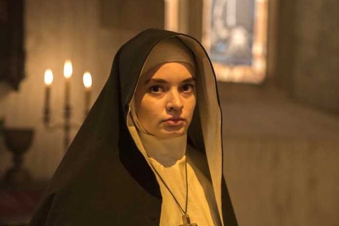 This image released by Warner Bros. Pictures shows Ingrid Bisu in a scene from “The Nun.” (Justin Lubin/Warner Bros. Pictures via AP)