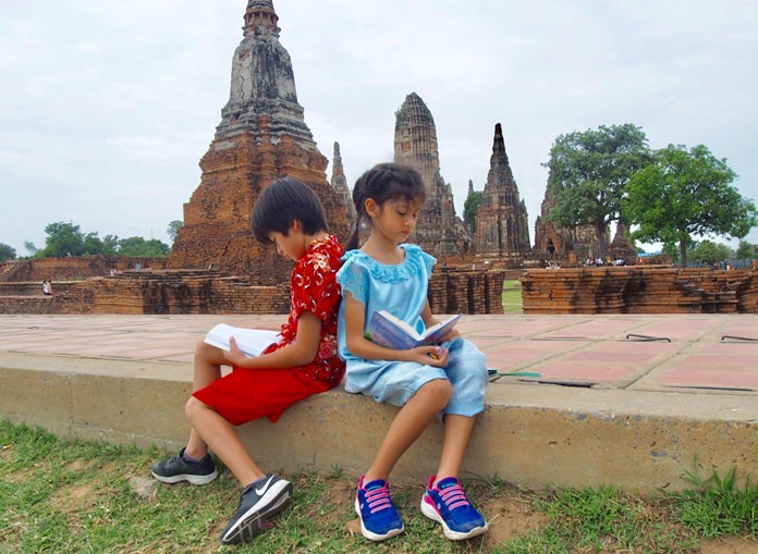 These students took a break from the temples to catch up on some reading.